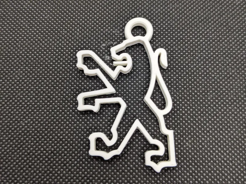 Porte clef logo lion Peugeot Année 80