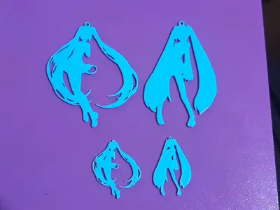 Two Hatsune Miku silhouette keychains