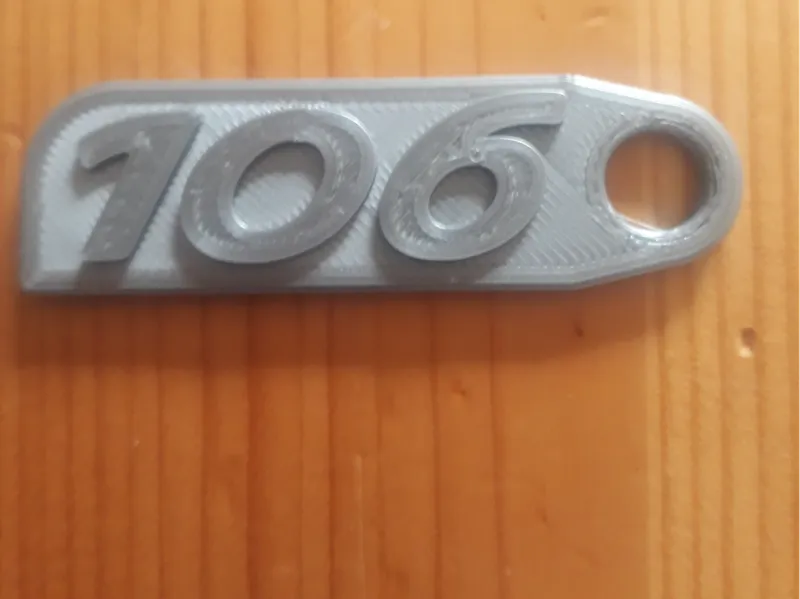 Porte clef logo Peugeot 106