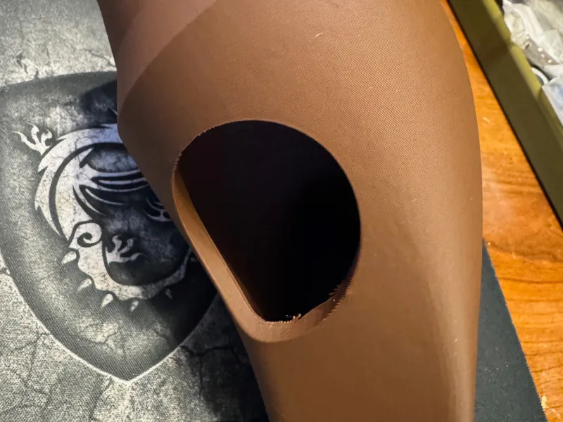 Cardboard poop shoot with access hole for clogs
