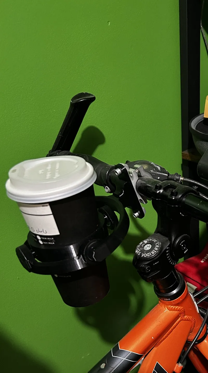 Bicycle handle bar adaptor to gyro cup holder