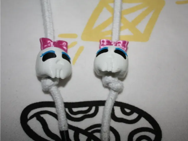 Cute skull beads with women's bow.