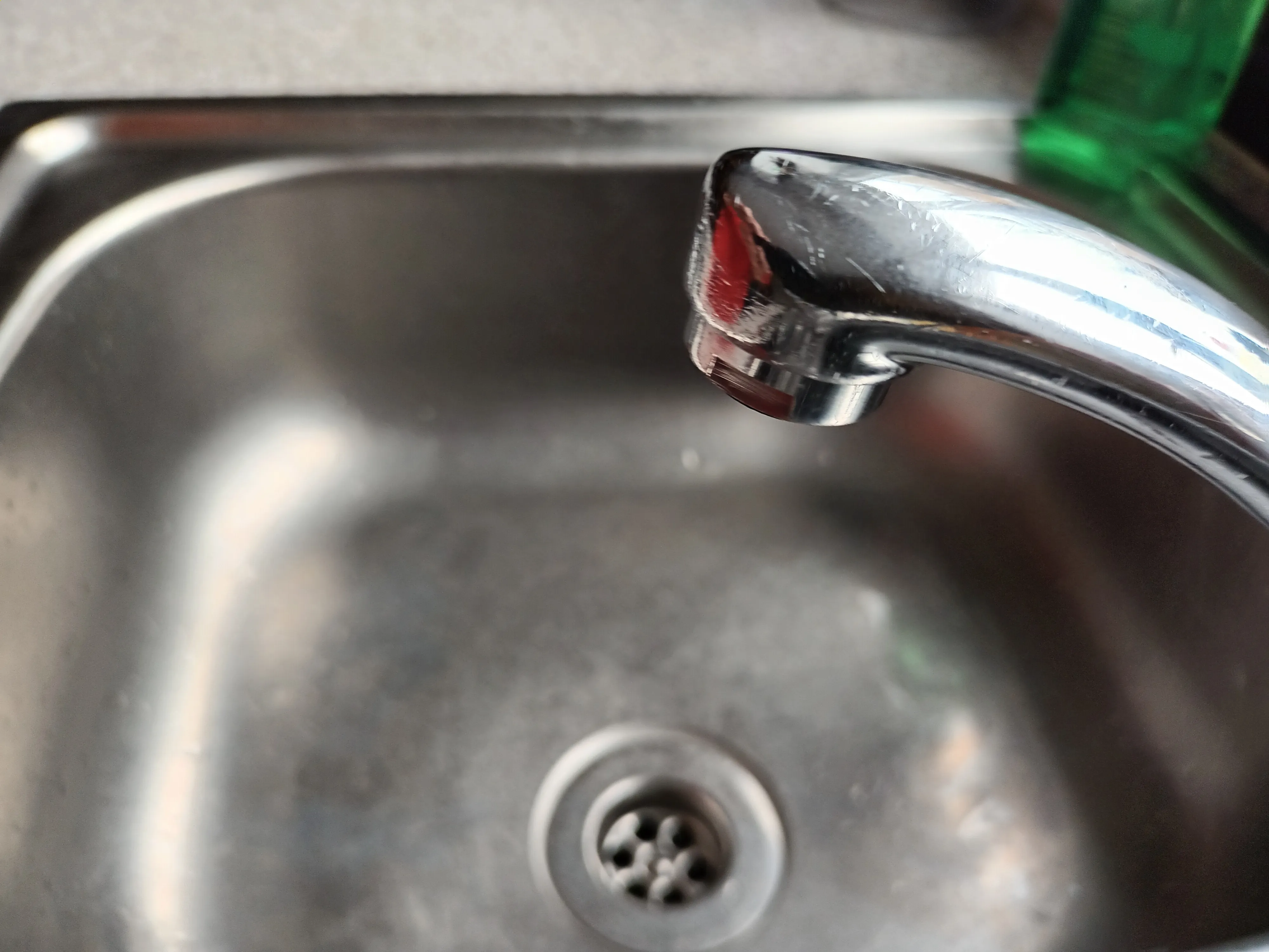 UNSCREW BOTTOM OF TAP