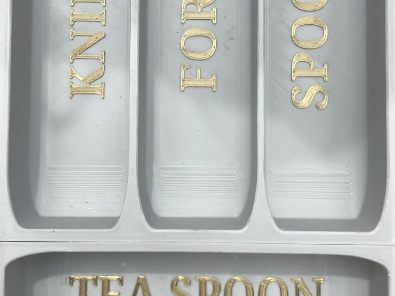 Labelled cutlery organiser.