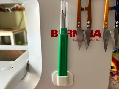 Seam ripper holder for sewing machine