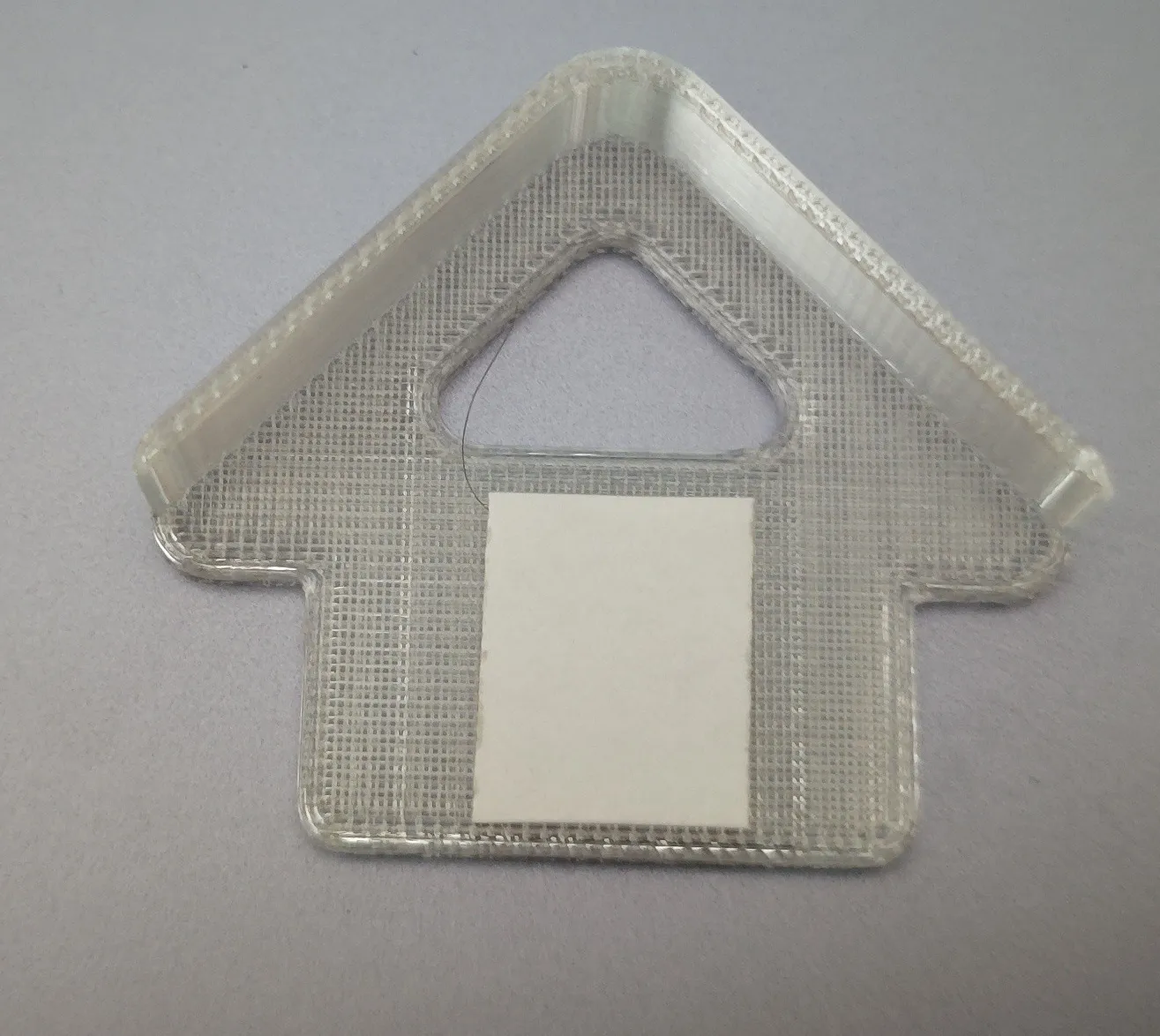 Double-sided adhesive tape placement