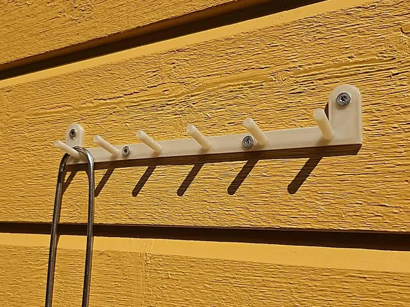 Basic wall bracket with six hook stems
