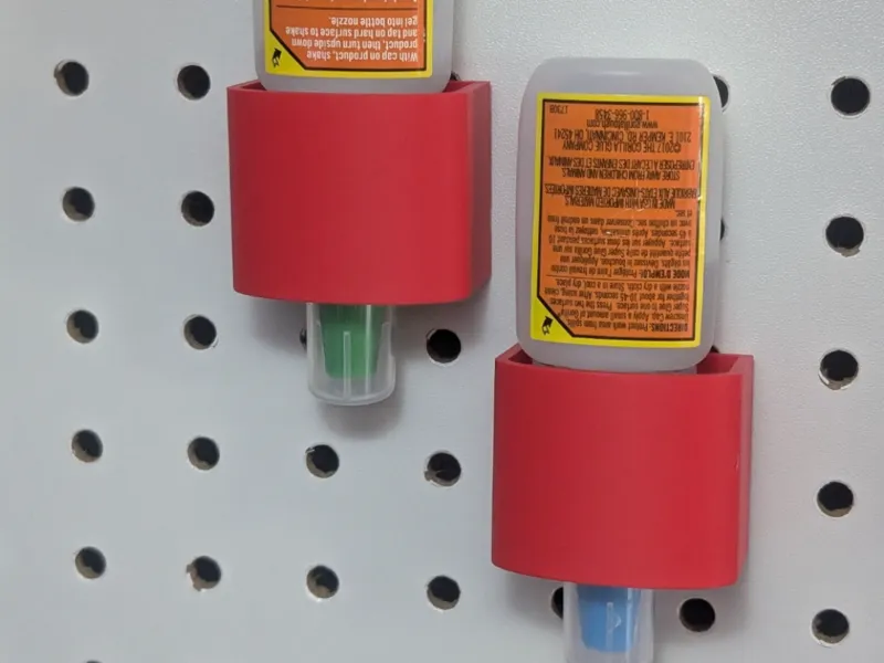 Super glue holder down pegboard