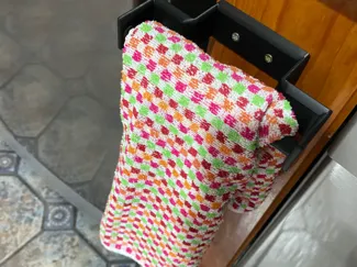 Gancho o colgador para paños y toallas