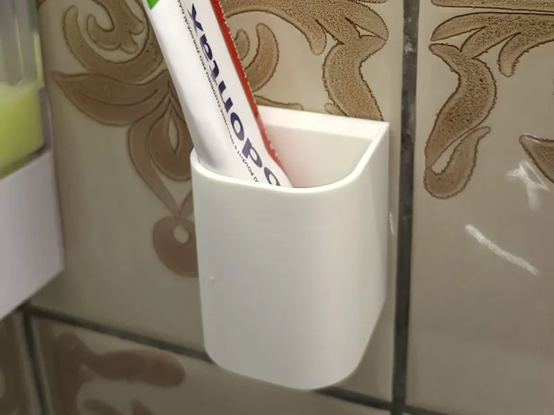 Tooth paste holder
