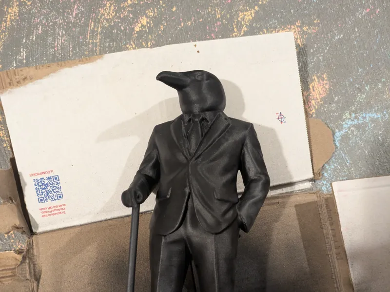 dapper raven man sculpture