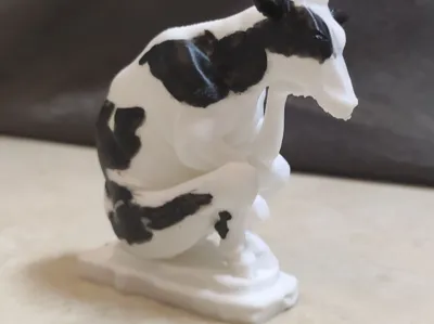Cow making concentrated milk sculpture