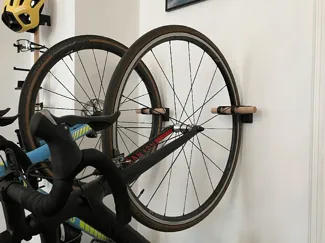 Wall mount for holding bikes in vertical