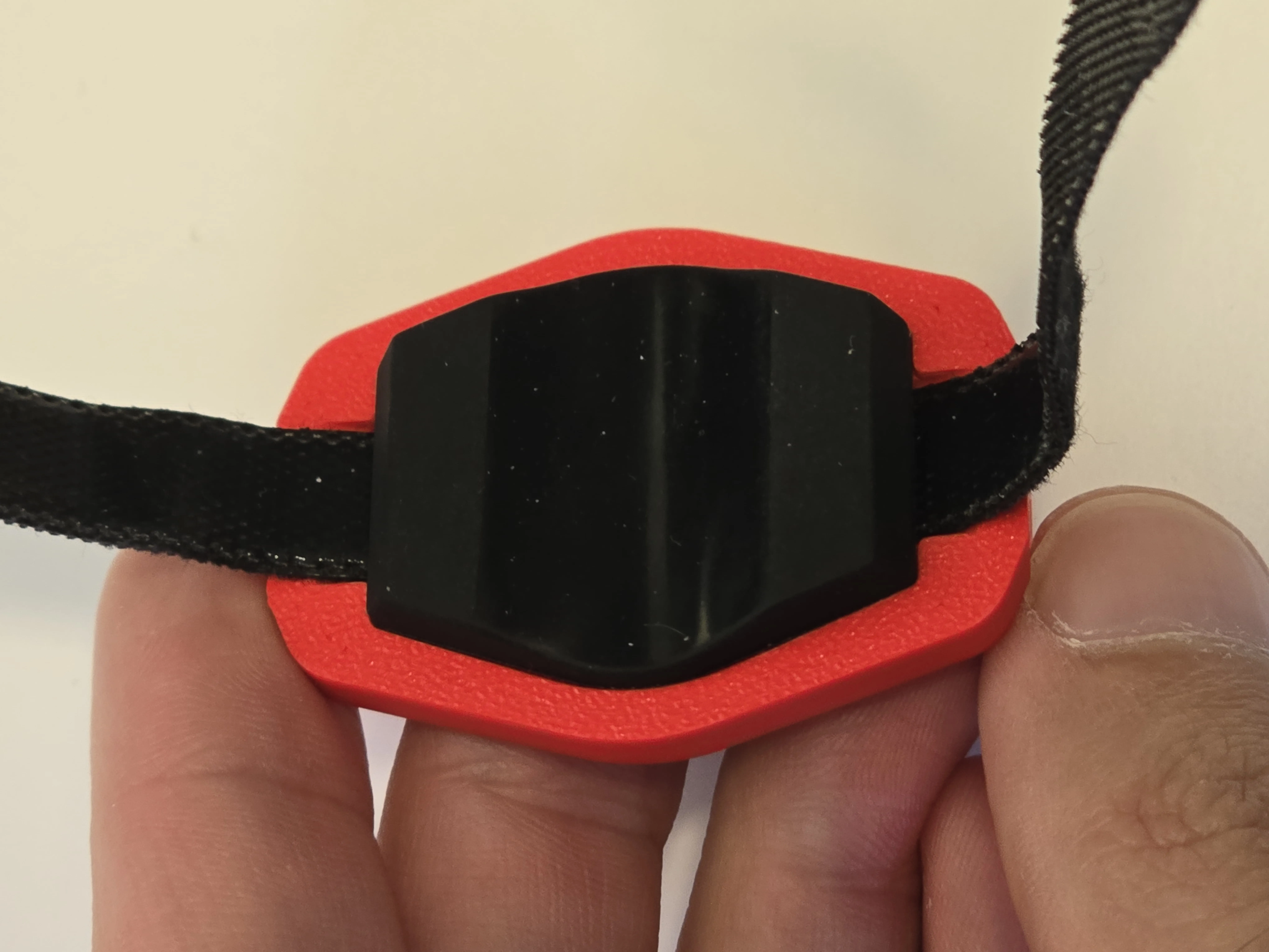 Bottom view where the pocket for the rubber piece (rubber piece inserted) is located