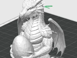 dragon figure holding an egg