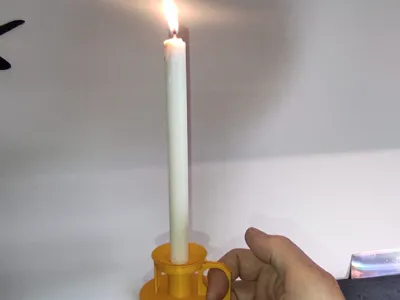 Simple candlestick and decorative candle