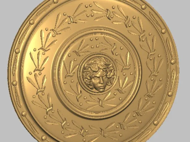 Escudo con patrón ornamental y rostro central