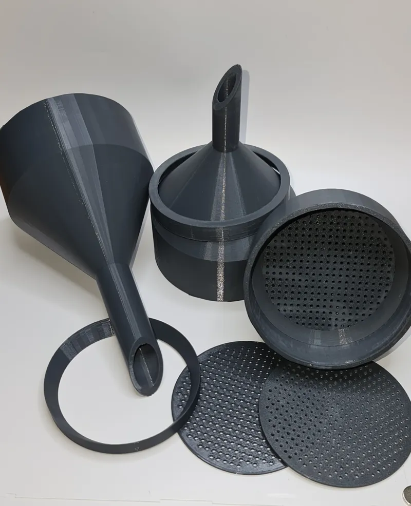 A funnel with a strainer for 90 mm filters