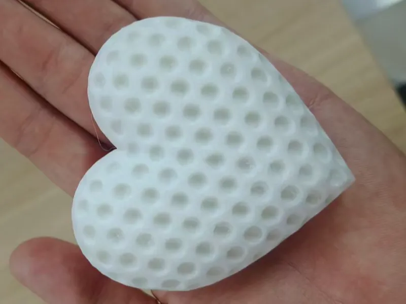 Heart-shaped golf ball