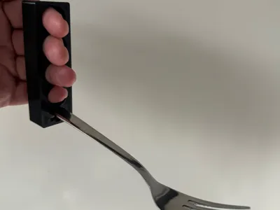 Cutlery holder for wrist disablility