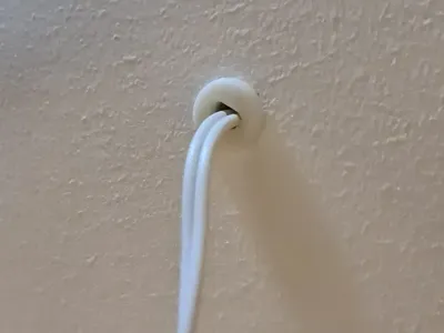 Drywall cable grommet