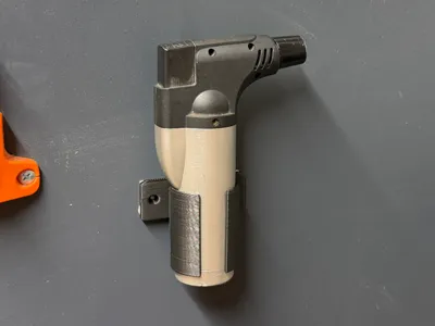Piezoelectric lighter holder for bolt / tape 