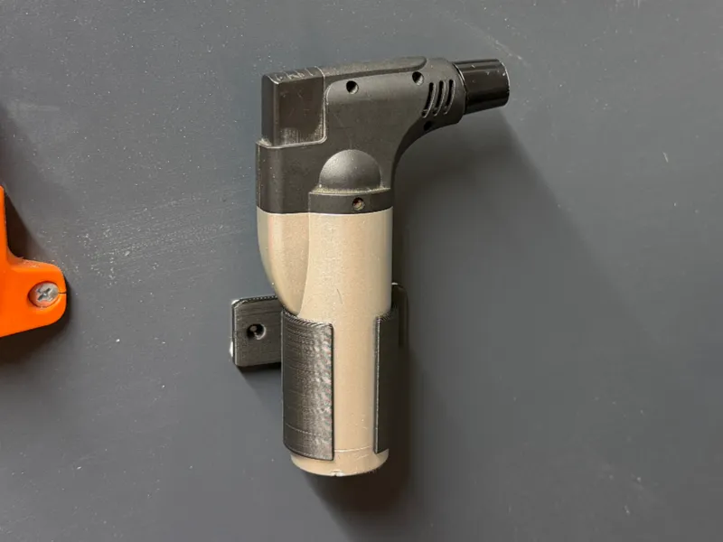 Piezoelectric lighter holder for bolt / tape 
