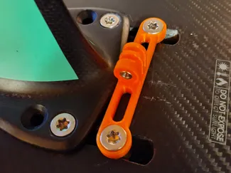 Adapter to attach a lamp to a foil board.