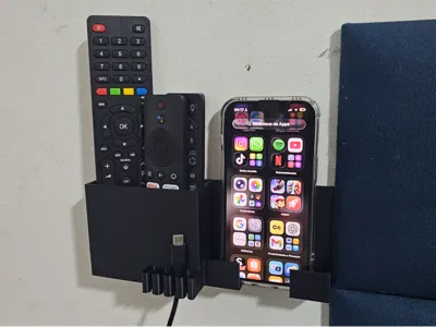 Cell phone and remote control holder with cable clip