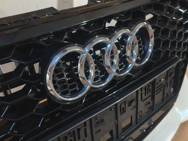 Audi logo holder front grill attachment