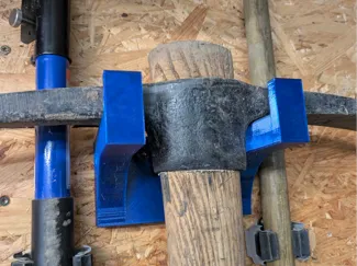 Wall bracket for heavy gardener tool