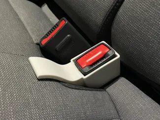 Seat belt buckle guide