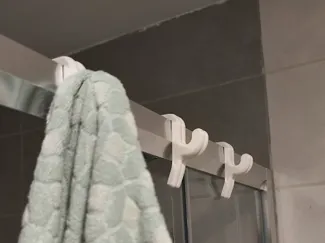 Shower cabin towel hanger