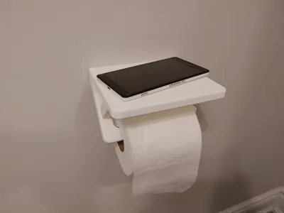 Toilet paper roll holder with phone shelf