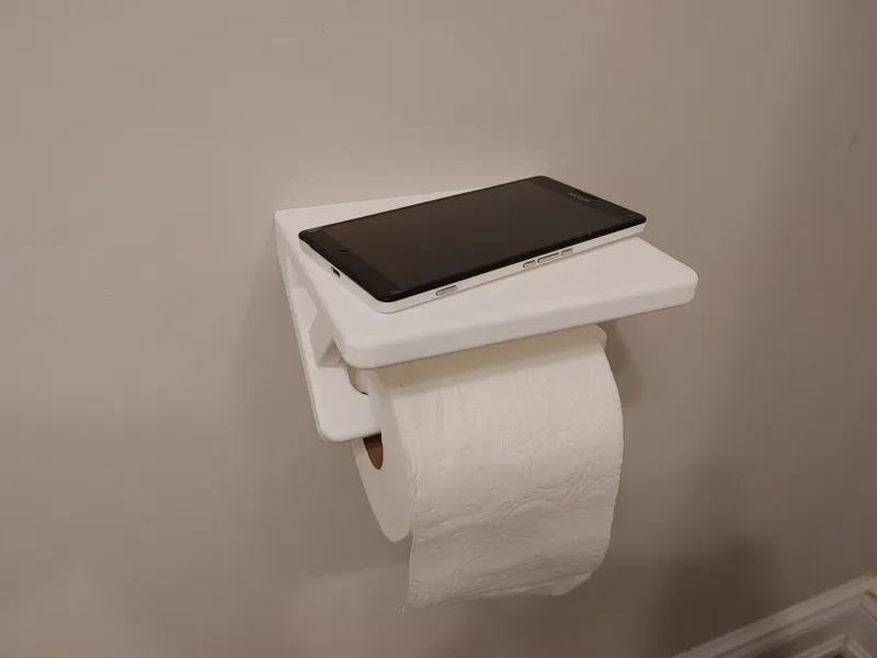 Toilet paper roll holder with phone shelf