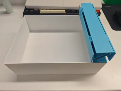 Storage box with roller shutter