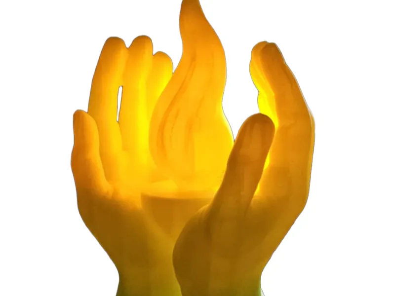 Hands holding a candle