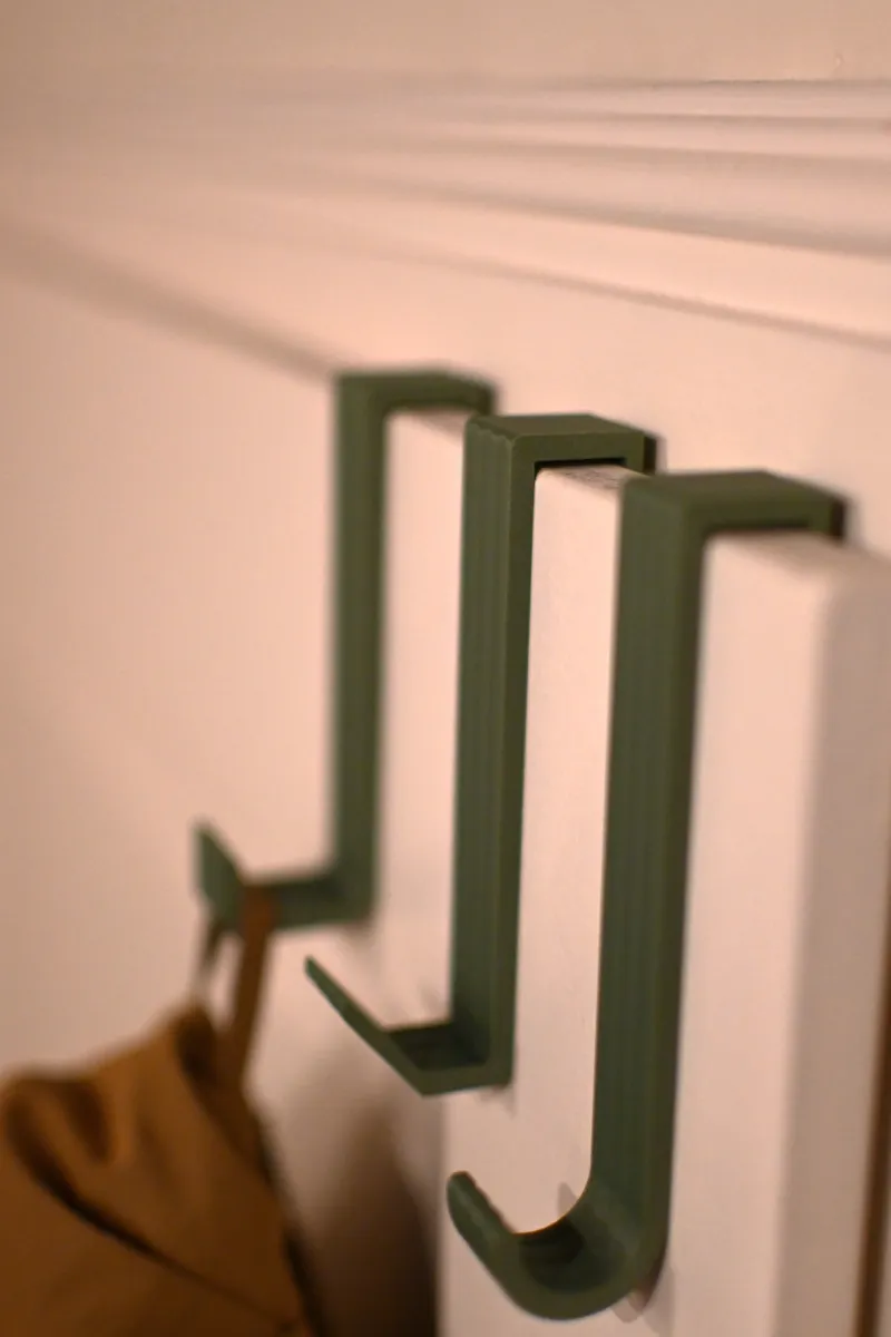 Door hook for hanging clothes