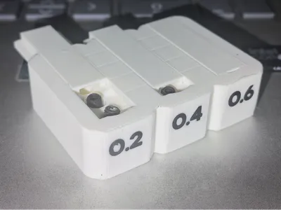 Interchangeable Nozzle Organizer, Each with Its Own Slot