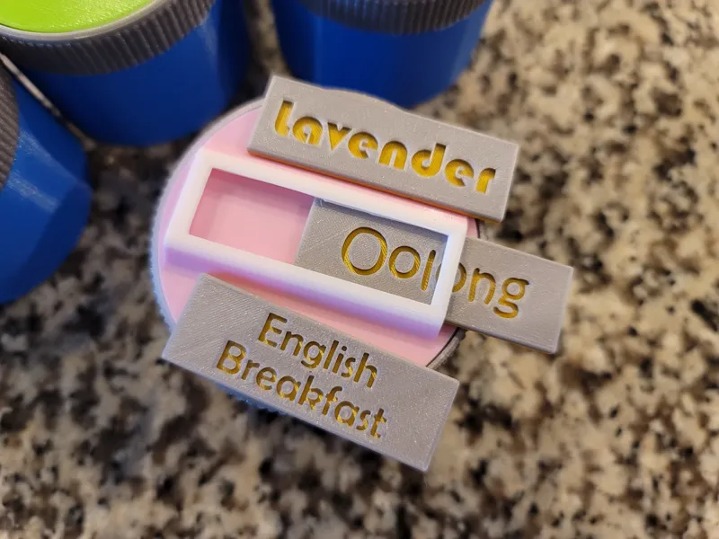 Tea containers with interchangeable labels