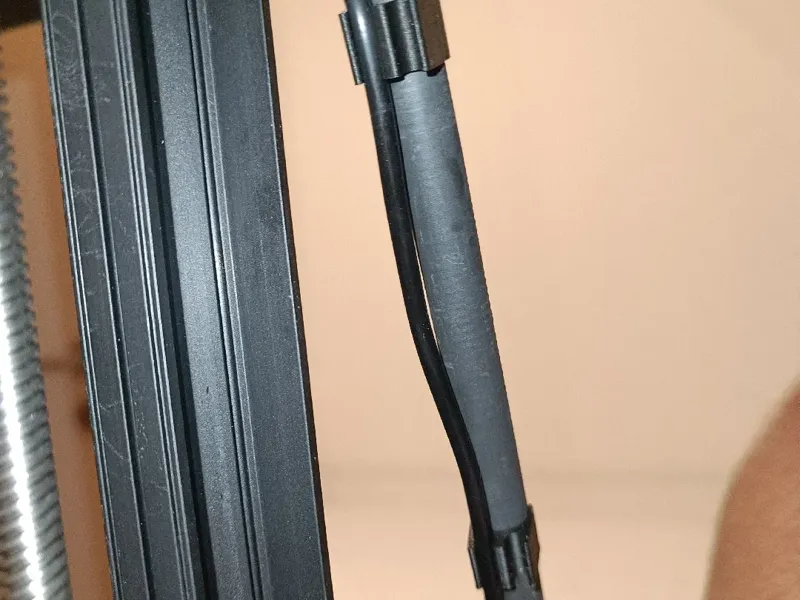 Cable holder for a 10mm rod, holds 1 or 2 cables