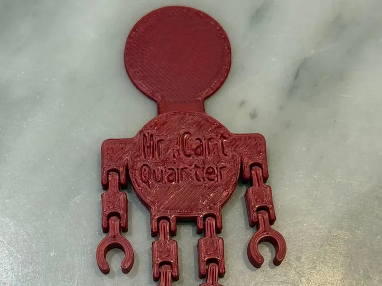 Bonhomme articulé — jeton de caddie