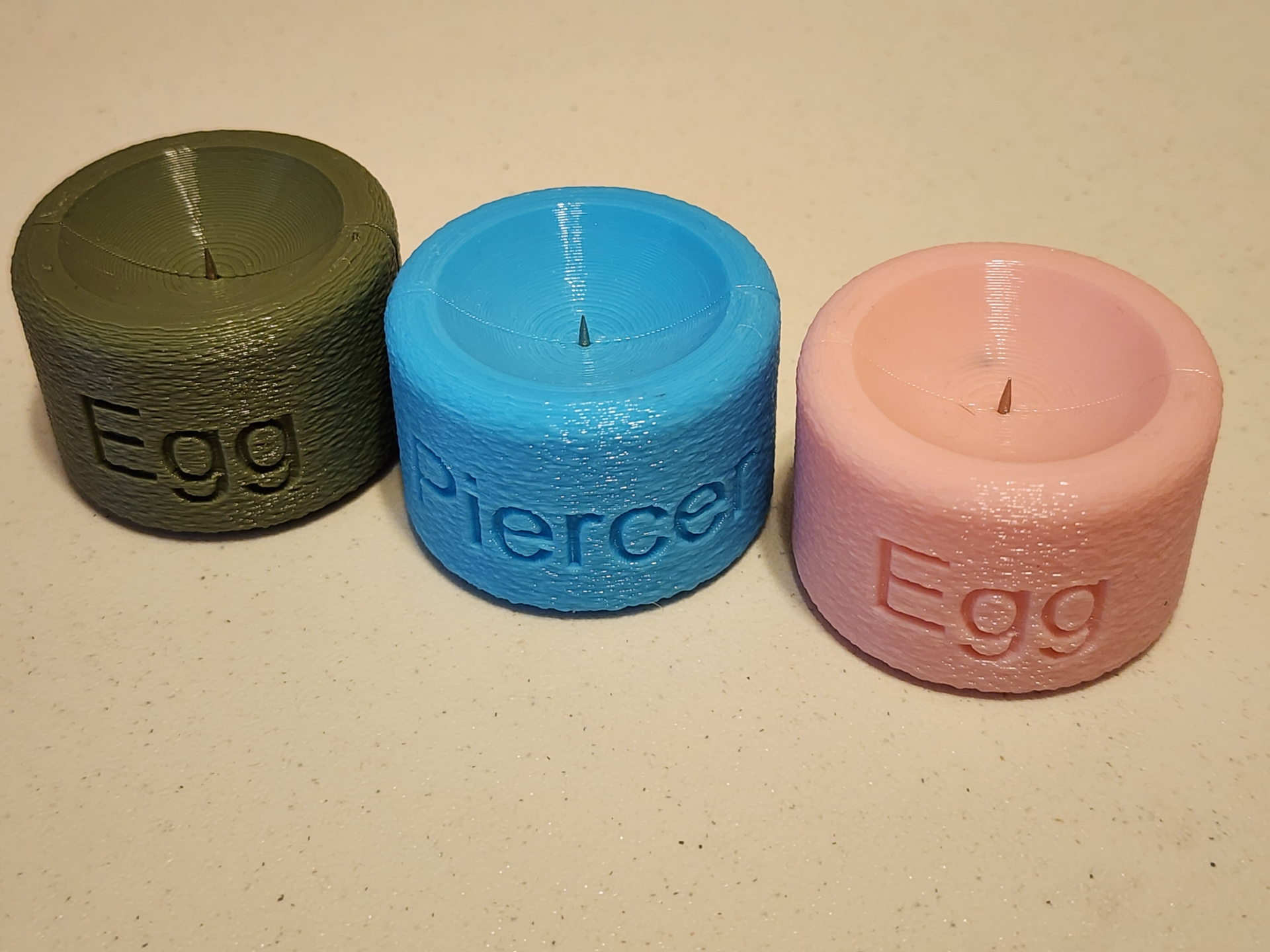 Egg piercer - helps keep eggs from cracking.