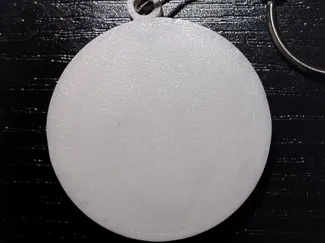 Flat round pocket whistle keychain