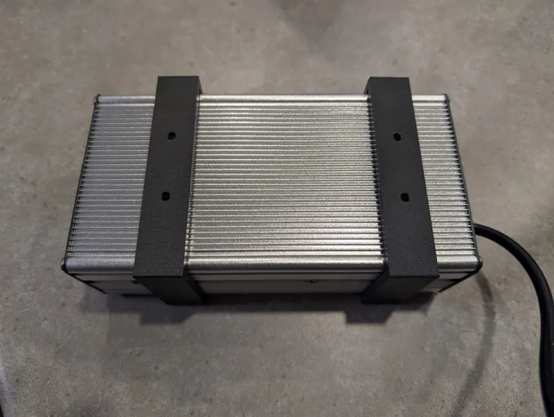 Customizable power adapter holder (OpenSCAD)