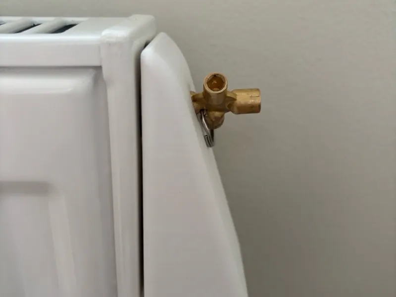 Radiator bleed water container