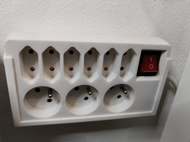 Extension cord wall mount