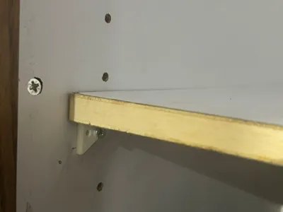 Small plastic shelf bracket