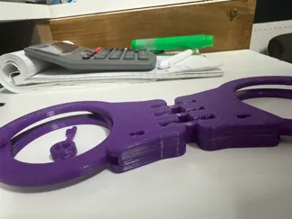 Hinged handcuffs
