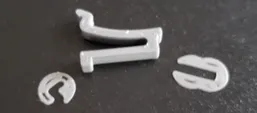 A white plastic number on a black surface
AI-generated content may be incorrect.